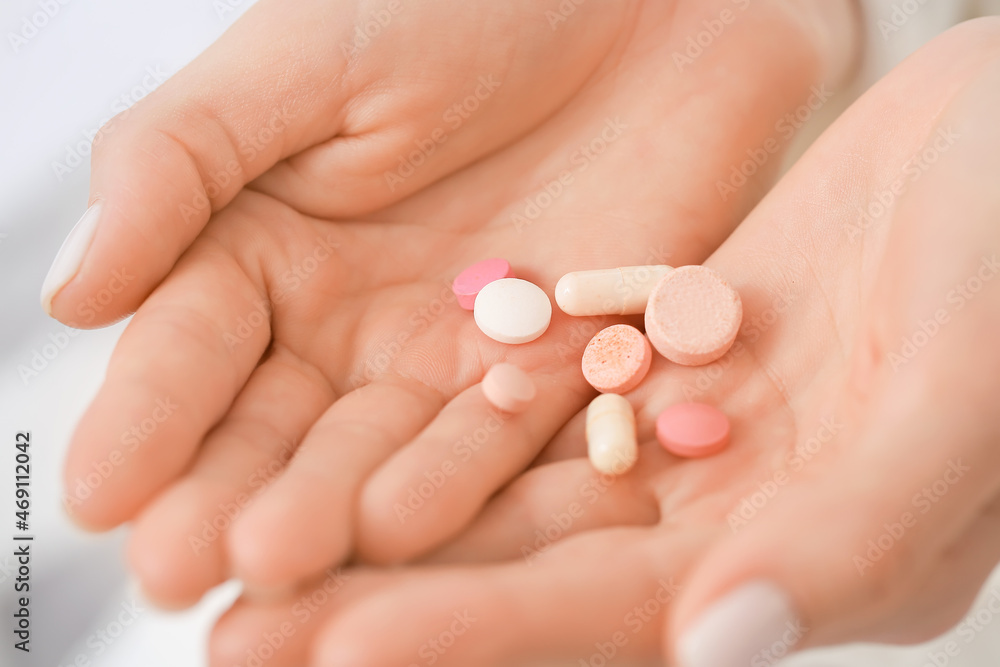 Female hands with pills, closeup Female hands with pills, closeup