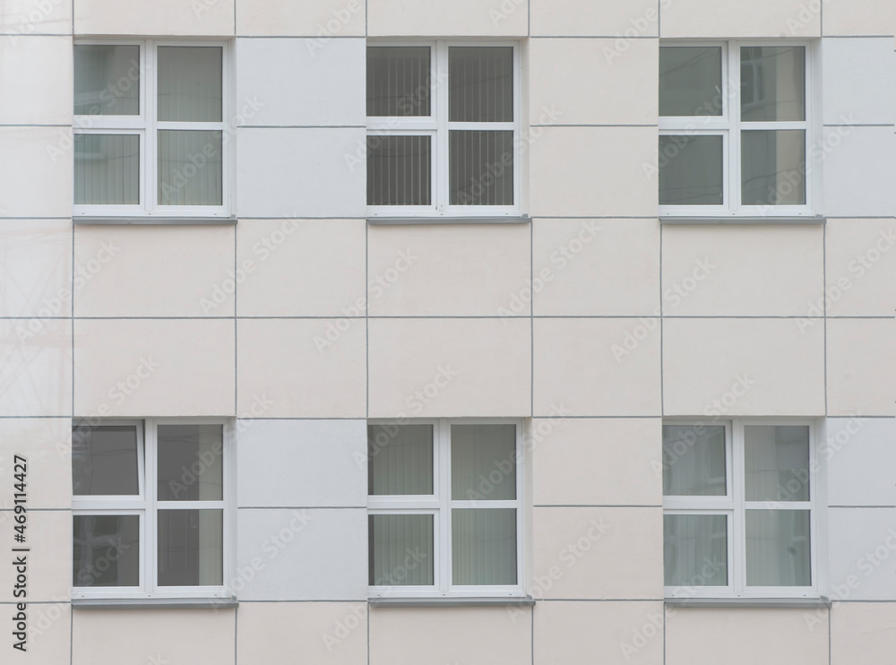 Background windows in a modern building made of tiles. Background windows in a modern building made of tiles.