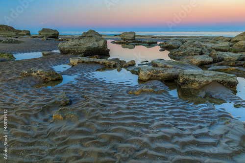 Coast of the Caspian Sea at sunset. photo