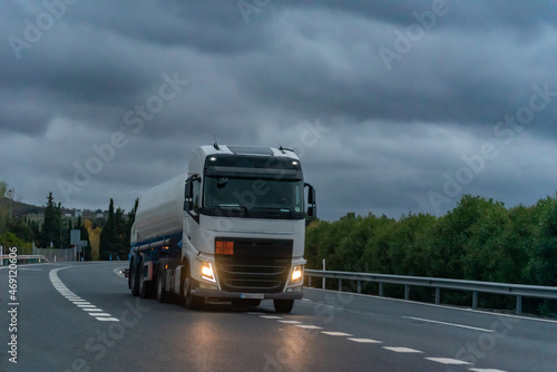 Tanker truck for the transport of dangerous gases circulating on a stormy day.