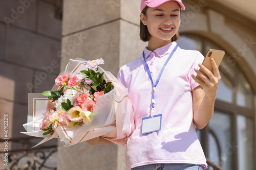 Female courier with bouquet...