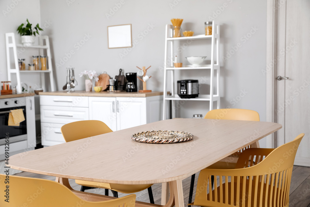 Fototapeta premium Dining table in kitchen interior