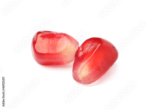 Juicy red pomegranate seeds on white background © New Africa