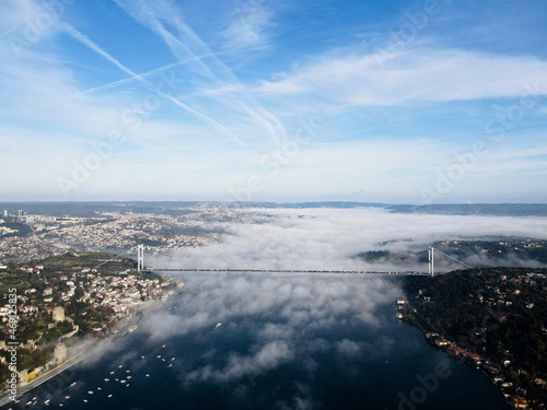 istanbul bosporus drone view in foggy day with fatih sultan mehmet bridge