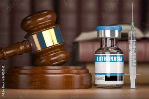 Euthanasia concept. Gavel as a symbol of legal system vith vial and syringe. photo
