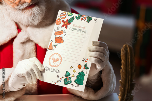 Santa Claus with letter at ...