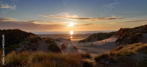 Formby Beach Sunset during lockdown 1 in the UK, taken from the top of a sandune looking over the Mersey entering the sea, not far from Southport, Merseyside photo