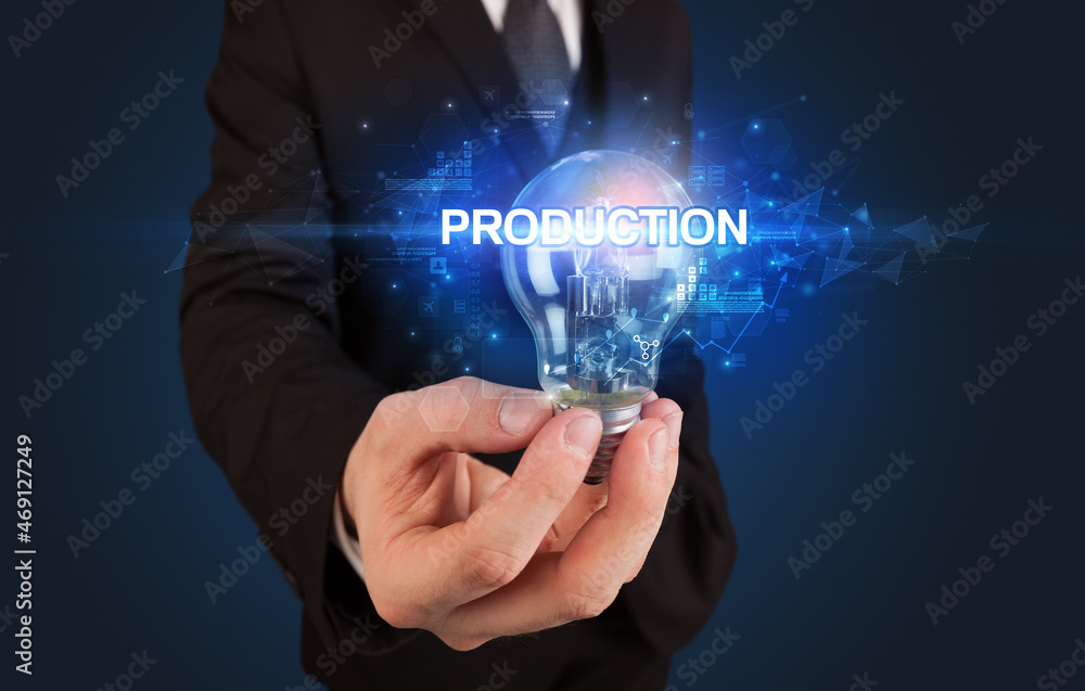 Businessman holding a light bulb Businessman holding a light bulb