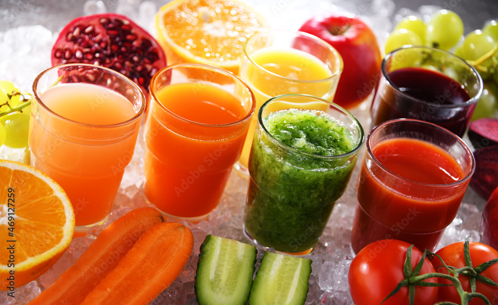 Glasses with fresh organic vegetable and fruit juices Glasses with fresh organic vegetable and fruit juices