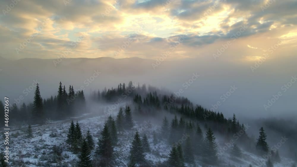 beautiful winter foggy morning in the mountains at dawn, dramatic aerial mountain landscape, breathtaking scenery, flying above the morning fog. beautiful winter foggy morning in the mountains at dawn, dramatic aerial mountain landscape, breathtaking scenery, flying above the morning fog.