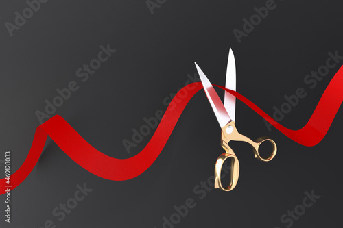 Red ribbon golden scissors cutting with Text space 3D rendering