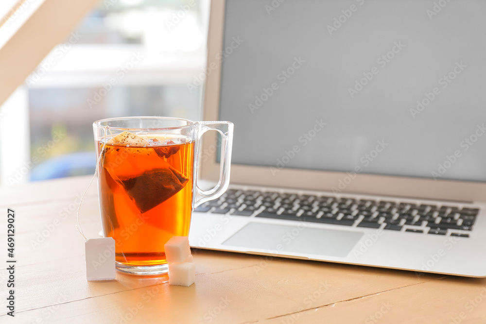 Glass cup of hot tea on table in cafe Glass cup of hot tea on table in cafe