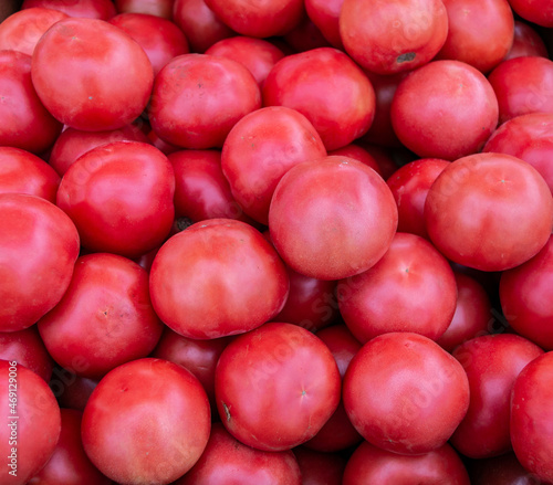 Lots of red tomatoes. Red ripe tomatoes. Close-up. Background or texture of tomatoes.