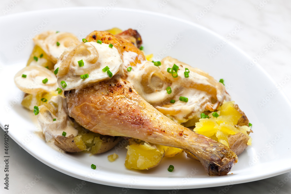 chicken leg on creamy onion sauce with potatoes chicken leg on creamy onion sauce with potatoes