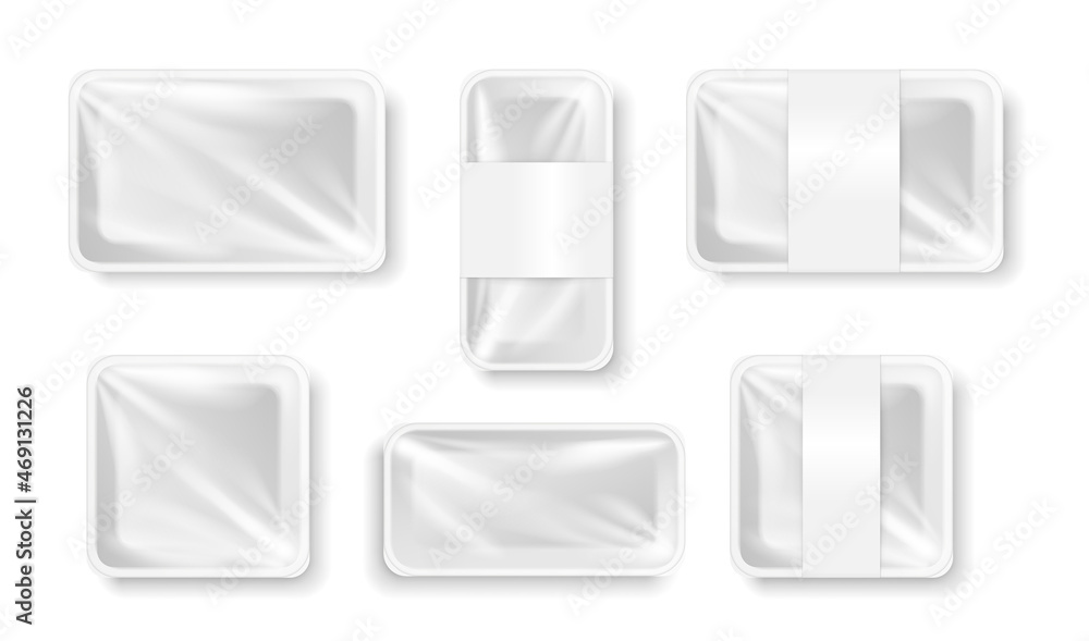White plastic container for food products. Empty wrapped food tray isolated on white background White plastic container for food products. Empty wrapped food tray isolated on white background