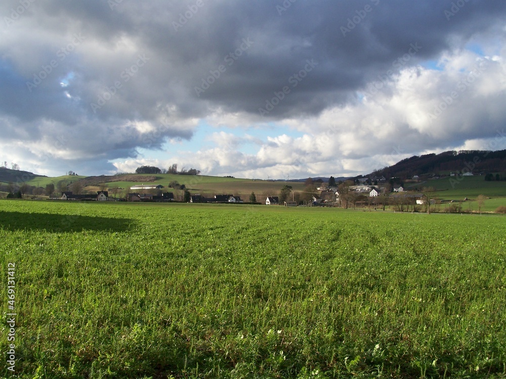 Dark clouds over green fields near Amecke, Sauerland, North Rhine-Westphalia, Germany Dark clouds over green fields near Amecke, Sauerland, North Rhine-Westphalia, Germany