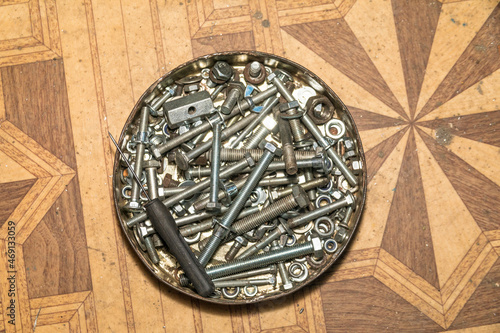 Bolts and nuts in a metal box in the master