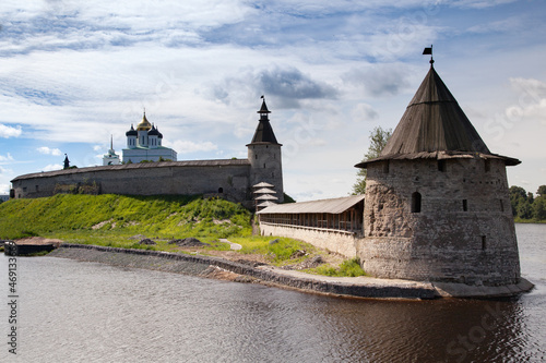 Stone tower and Pskov Kremlin fortress wall at the confluence of two rivers, Russia