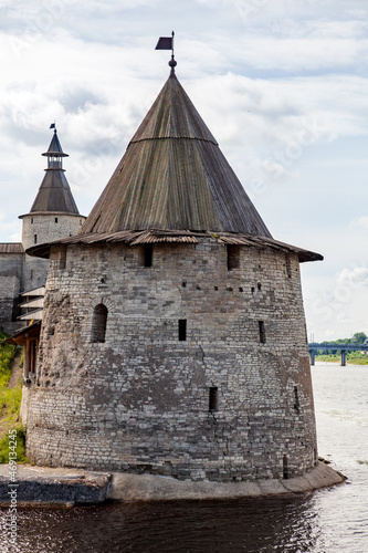 Stone tower and Pskov Kremlin fortress wall at the confluence of two rivers, Russia