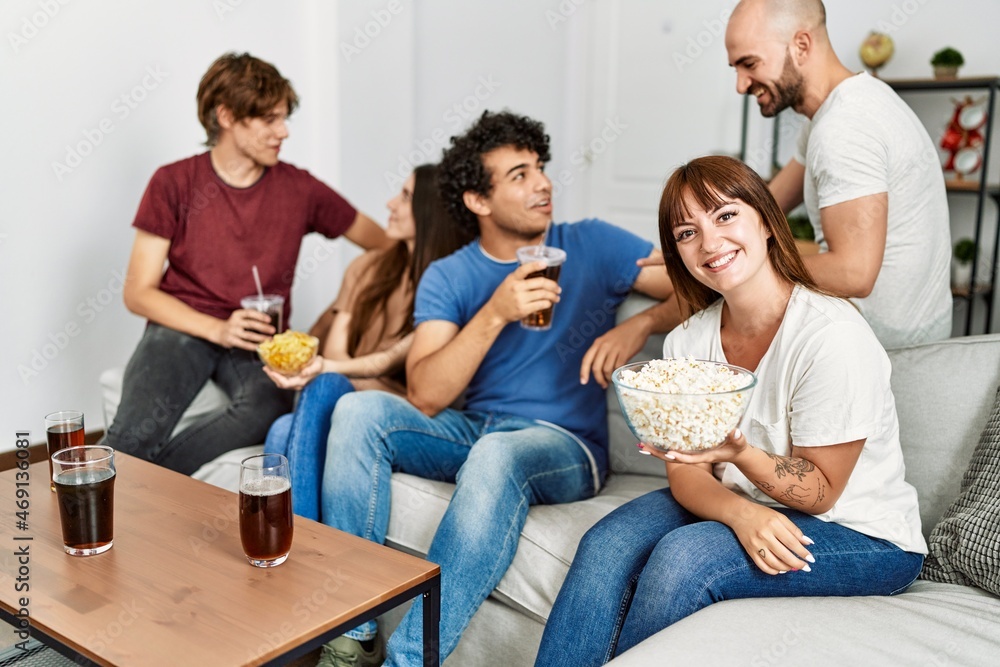 Group of young friends having party sitting on the sofa at home. Group of young friends having party sitting on the sofa at home.