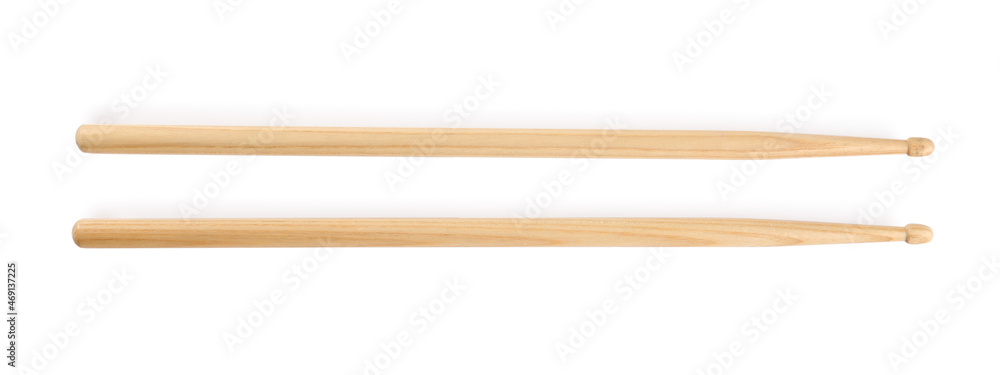 Two wooden drumsticks on white background, top view Two wooden drumsticks on white background, top view