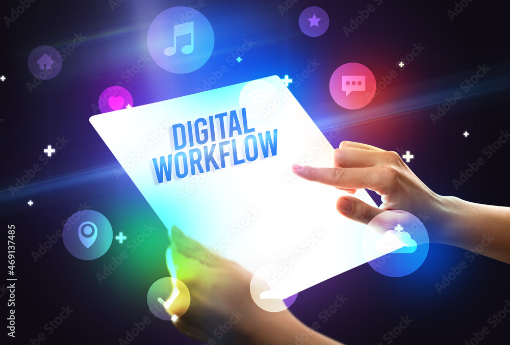 Holding futuristic tablet, new media concept Holding futuristic tablet, new media concept