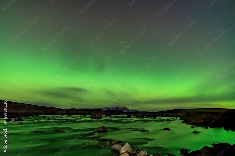 Aurora borealis lights, river and star trail