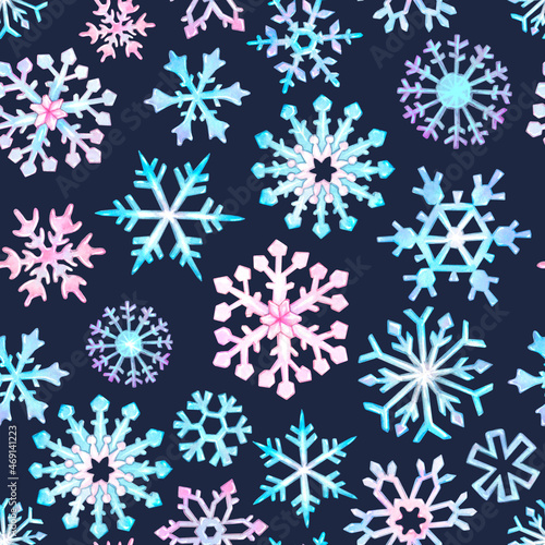 Watercolor seamless pattern of light blue and light pink snowflakes on a dark blue background. Winter  New Year s pattern.
