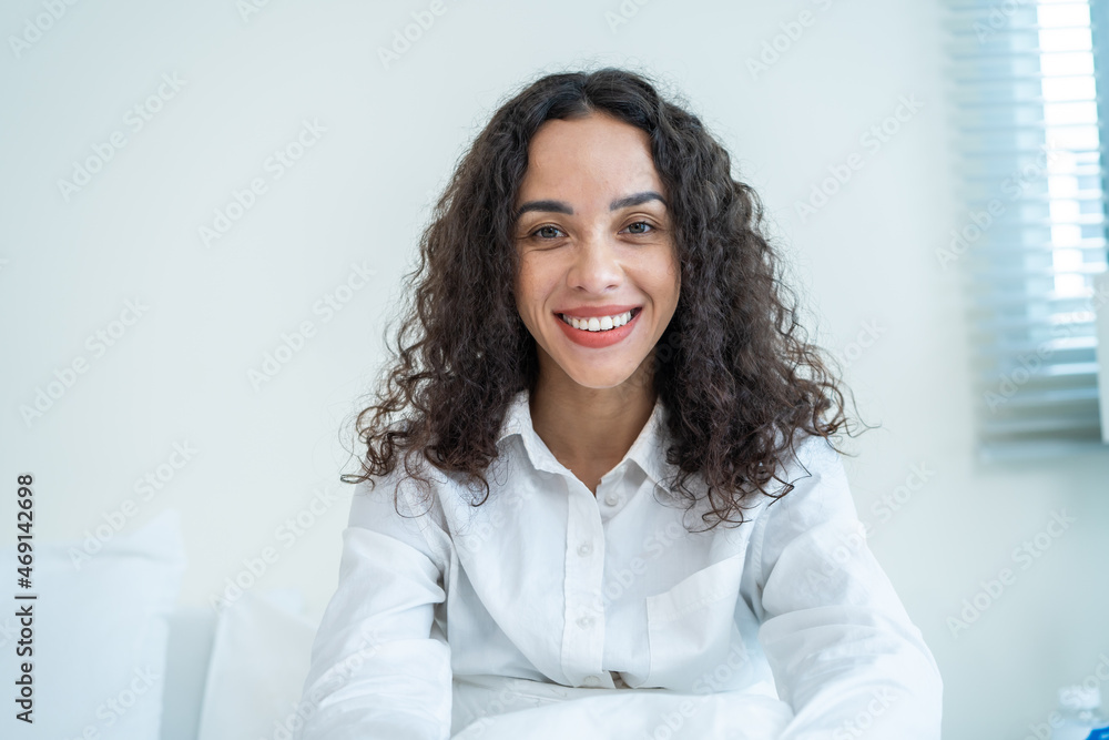 Portrait of Latino Beautiful girl in pajamas smile and look at camera. Portrait of Latino Beautiful girl in pajamas smile and look at camera.