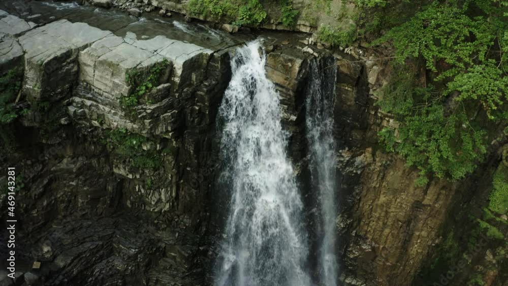 Waterfall on the mountain river Carpathians. Waterfall, fast mountain water. Aerial Waterfall on the mountain river Carpathians. Waterfall, fast mountain water. Aerial