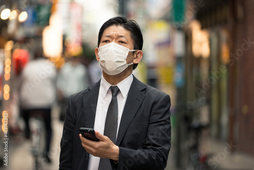 Japanese businessman in Tokyo with formal business suit photo