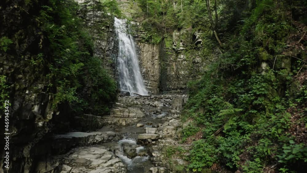 Waterfall on the mountain river Carpathians. Waterfall, fast mountain water. Aerial Waterfall on the mountain river Carpathians. Waterfall, fast mountain water. Aerial