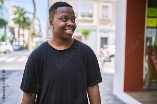 Young african american transgender smiling confident at street photo