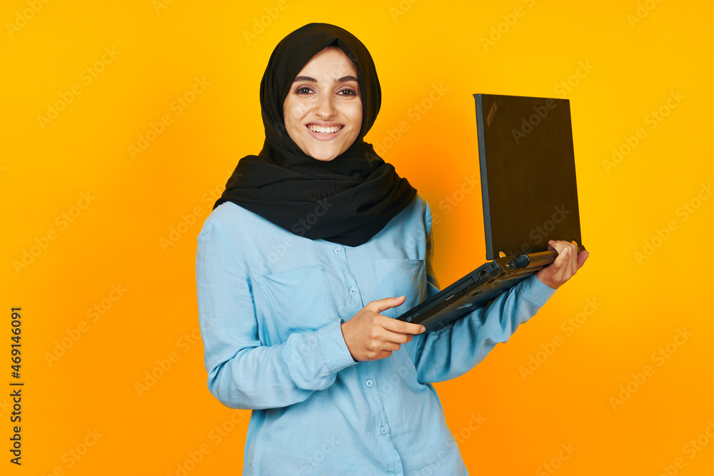 arab woman with laptop in hands technology emotions ethnicity model arab woman with laptop in hands technology emotions ethnicity model