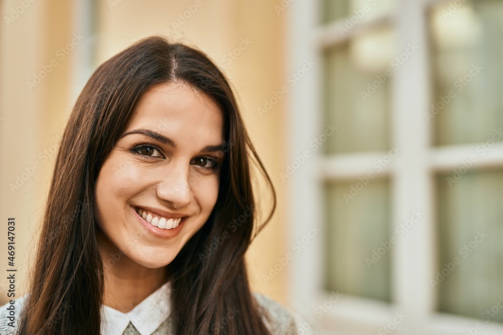 Young hispanic woman smiling happy standing at the city. Young hispanic woman smiling happy standing at the city.