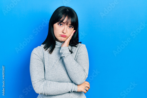 Young hispanic woman wearing casual clothes thinking looking tired and bored with depression problems with crossed arms.