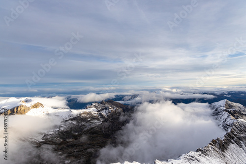 Fototapeta Naklejka Na Ścianę i Meble -  View from the summit of mountain Schilthorn in the Swiss Alps Switzerland at sunrise with dramatic clouds and fresh snow.