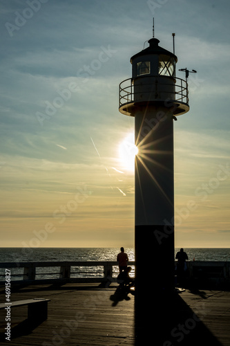 Sunlight diffraction and silhouettes by the lighthouse, Belgium