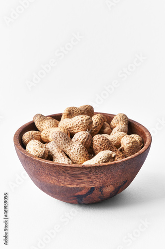  Bowl of peanuts with shell isolated on a white background