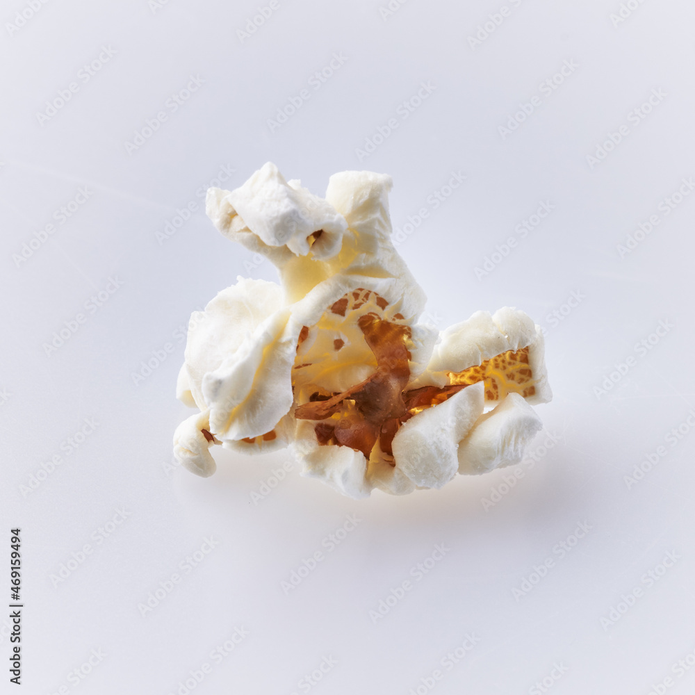 Single delicious salty popcorn isolated on a white background Single delicious salty popcorn isolated on a white background