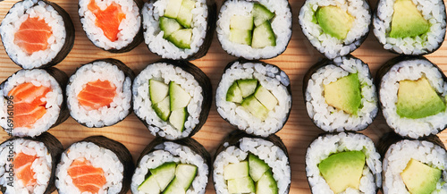  Group of avocado, salmon and cucumber sushi makis texture
