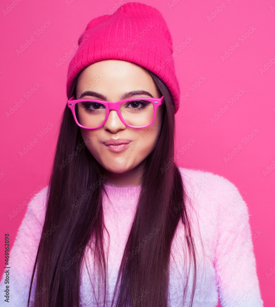 young pretty girl with brunette long hair posing cheerful on pink background, lifestyle people concept young pretty girl with brunette long hair posing cheerful on pink background, lifestyle people concept