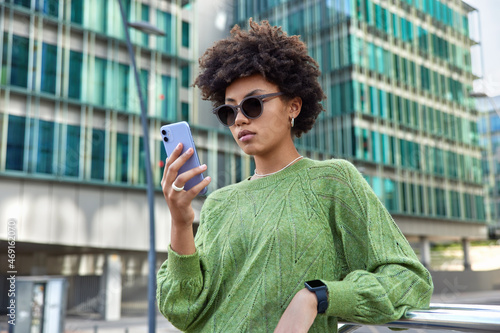 Slika na platnu Fashionable woman chats with friends in social networks surfs on internet websit