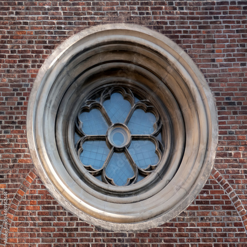 Tableau sur toile Beautiful large round window in the brick wall of the Dome Cathedral in Riga, Latvia, Europe
