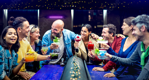 Photography Multicultural people toasting multicolored fancy drinks at fashion bar - Young f