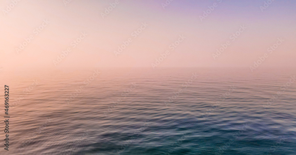 Calm Sea at sunset in pink colors