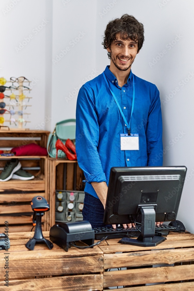 Young hispanic man smiling confident working at clothing store Young hispanic man smiling confident working at clothing store