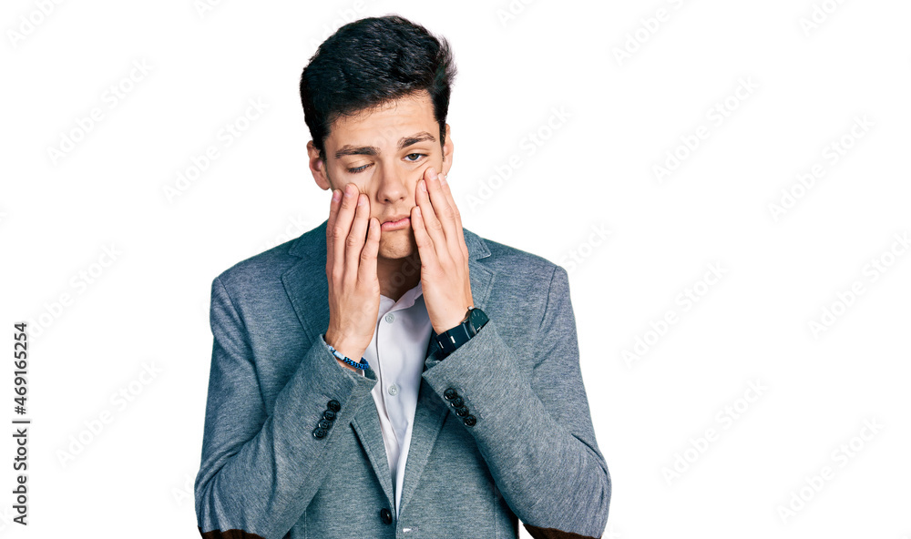 Young hispanic man wearing business clothes tired hands covering face, depression and sadness, upset and irritated for problem Young hispanic man wearing business clothes tired hands covering face, depression and sadness, upset and irritated for problem