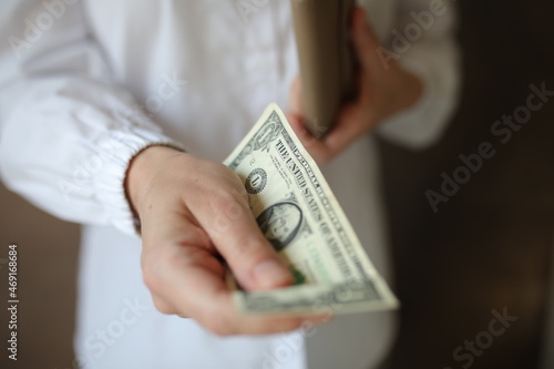 person holding money in hand