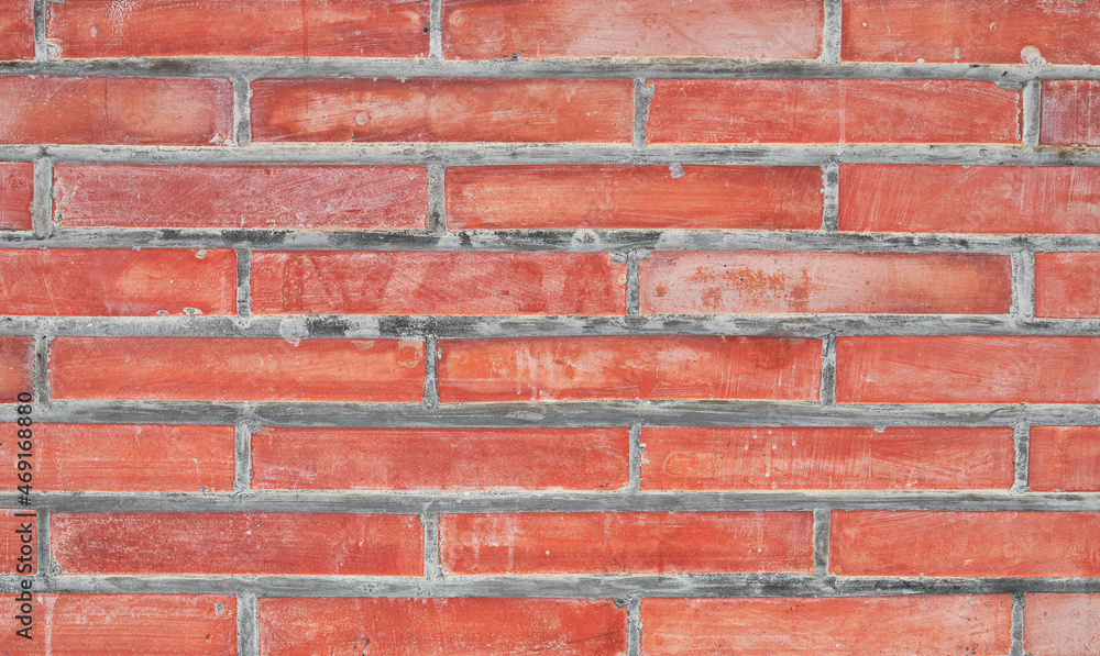 Fototapeta premium Brick wall texture with cracked tiles and cement. Classic brickwall surface background